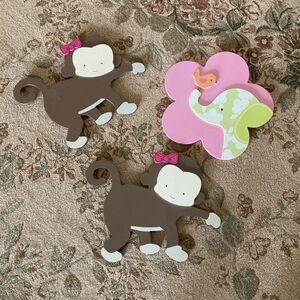 monkey and elephant decoration. brown and pink and green. Easy hang. Pictures.